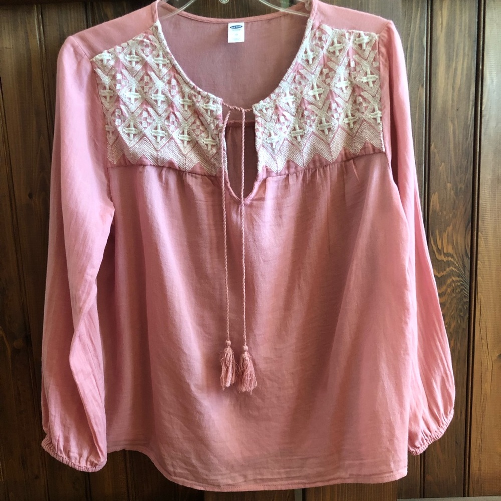 Comfy, light pink top with white stitching.